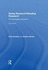 Doing Research/Reading Research: Re-Interrogating Education