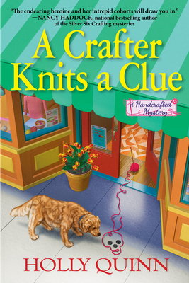A Crafter Knits a Clue: A Handcrafted Mystery - Quinn, Holly
